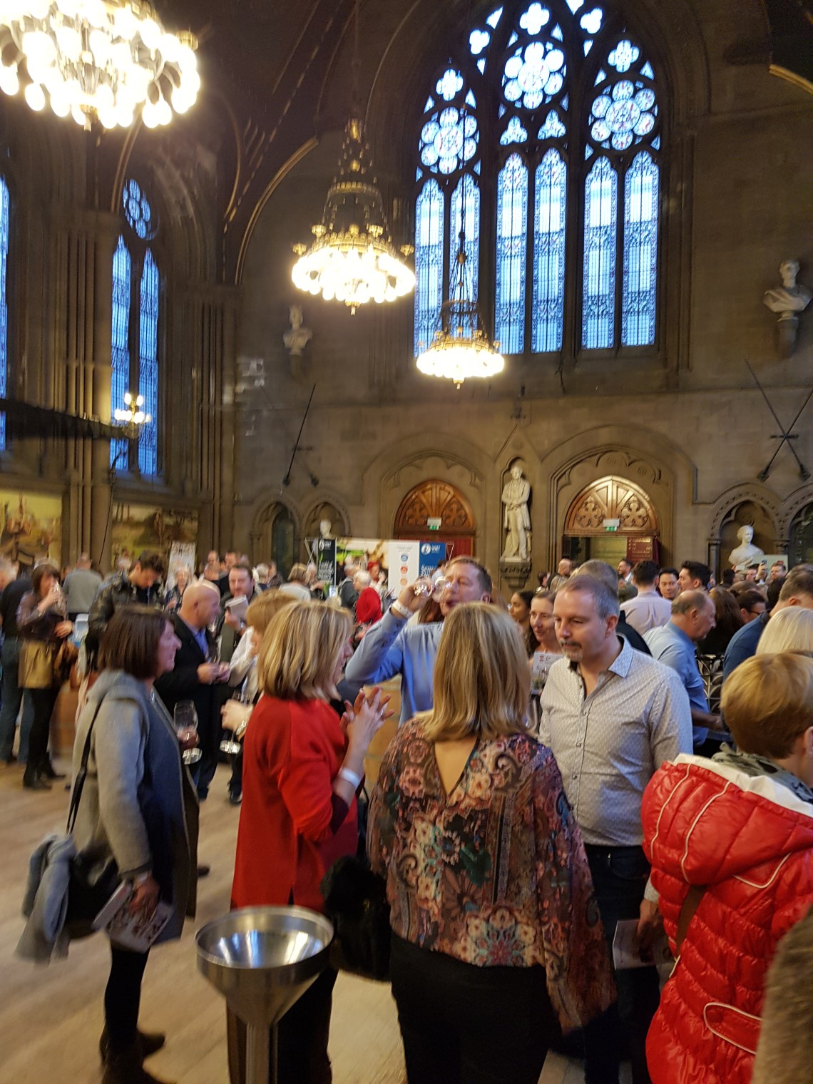 3 wine men packed hall